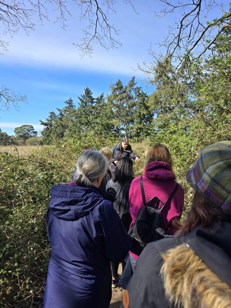 Julie Hancox explaining plants to a group on a foraging walk in Surrey